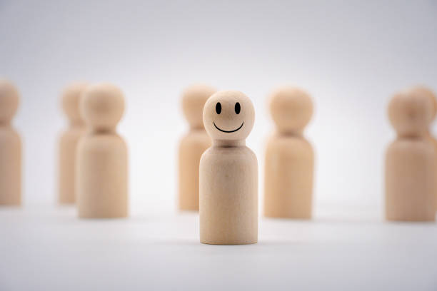 istock The smily face on one wooden human icon . 1319957488