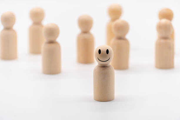 istock The smile face on one wooden human icon . 1319957525