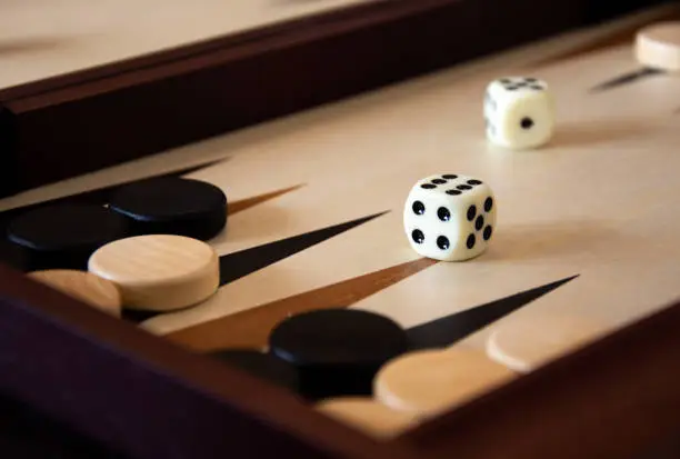 Backgammon dice and checkers. Board game. 2021