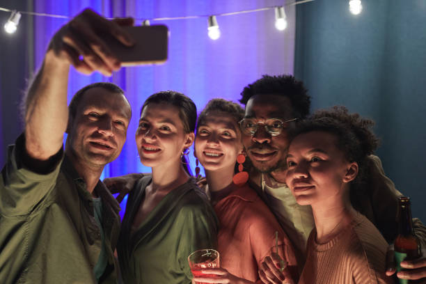istock Friends Taking Selfie at Party 1319959382