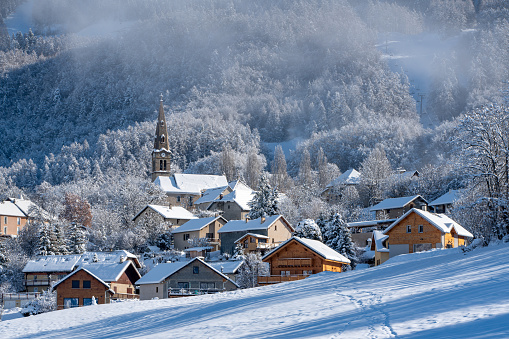 The village of Saint Leger les Melezes in the Champsaur Valley in winter. Ski resort in the Ecrins National Park, Alps, Hautes Alpes, France