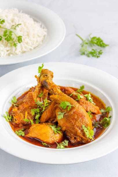 istock Authentic Indian Chicken Curry Top Down Photo on White Background 1319963207