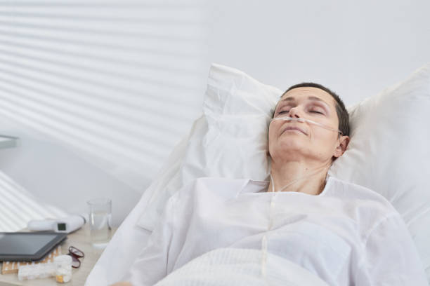 istock Sick woman lying on bed 1319963492