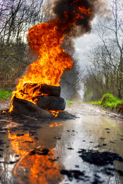 istock burning tires on the road 1319963715