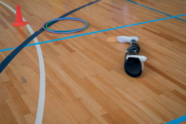 istock Prosthetic limb lying on volleyball court 1319965030