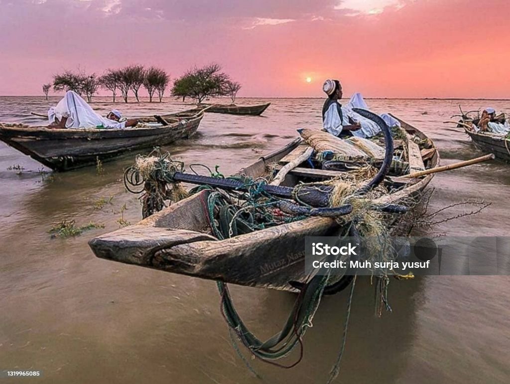 Africa,Sudan,Nile river:fishermen are watching a very beautiful sunset on the Nile fishermen are watching a very beautiful sunset on the Nile Sudan Stock Photo