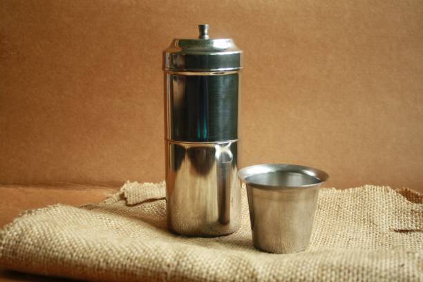 istock South Indian Traditional Filter coffee. Concept coffee time Coffee filter and cup(Tumbler) 1319965113