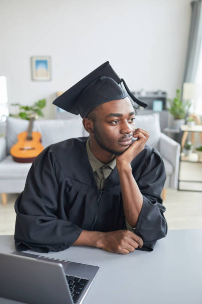 istock African American man preparing for graduation at home 1319965332