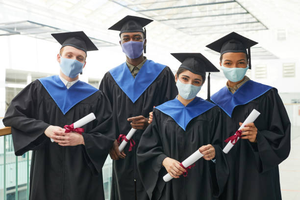 istock Diverse group of graduates wearing masks 1319965416