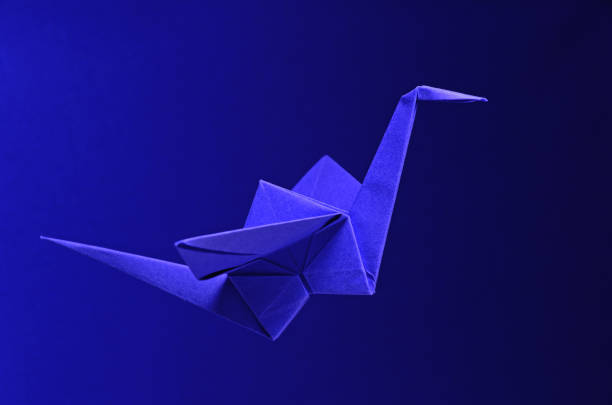 istock Blue Origami On Blue Background 1319965515