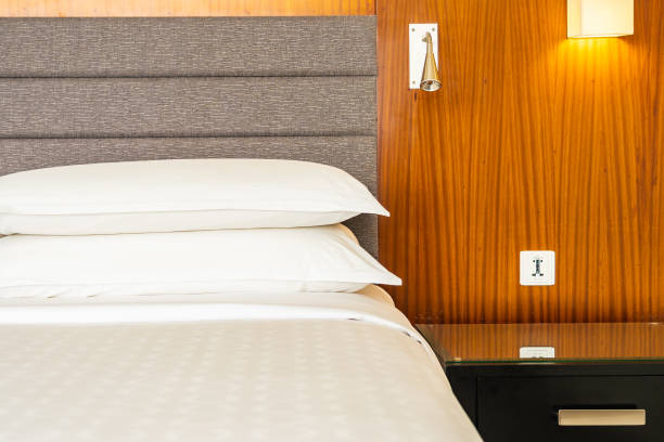 istock White Pillows On Bed In Hotel Room 1319965903