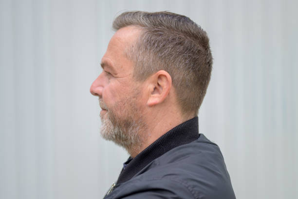 istock Profile view of a serious man with beard with copyspace 1319967763