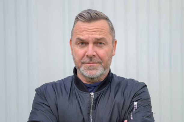 istock Sincere middle-aged man looking at camera with empathy 1319967781