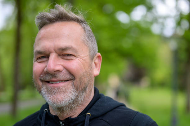 istock Close up head shot of a friendly middle-aged man 1319968728