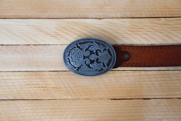 istock Leather cowboy belt on wooden background 1319968896