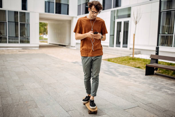 istock Young modern businessman commuting on skateboard 1319968901
