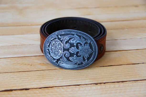 istock Leather cowboy belt on wooden background 1319968913