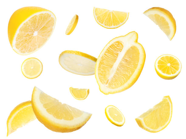 Fresh cut lemons flying on white background Fresh cut lemons flying on white background lemon stock pictures, royalty-free photos & images