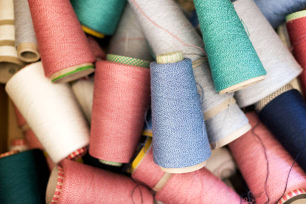 istock Full frame background texture of cashmere wool on spools 1319970119