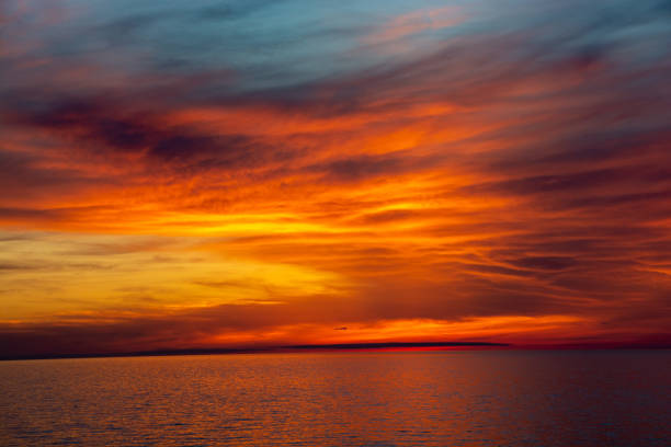 istock Beautiful dusk sea and orange sky 1319972218