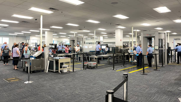 The TSA security area at the Orlando Sanford International Airport SFB in Sanford Florida. Sanford, FL USA - May 13, 2021:  The TSA security area at the Orlando Sanford International Airport SFB in Sanford Florida.Public Airport Photos are allowed. metal detector security stock pictures, royalty-free photos & images