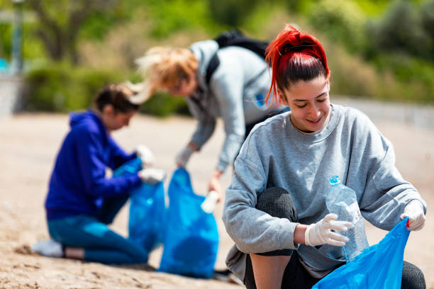 istock Group of  people cleaning beach area 1319975894