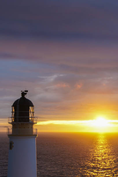 istock Sunset at a lighthouse near Melvaig in Scotland 1319979173