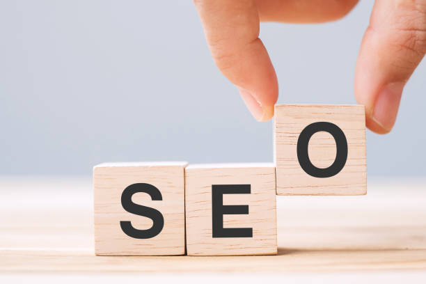 istock SEO (Search Engine Optimization) text wooden cube blocks on table background. Idea, Strategy, marketing, Keyword and Content concept 1319981651