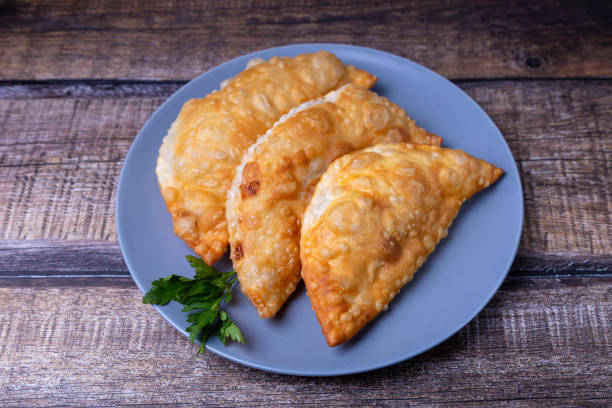 istock Chebureks with meat. Flat patty, deep-fried. A traditional dish. 1319982734