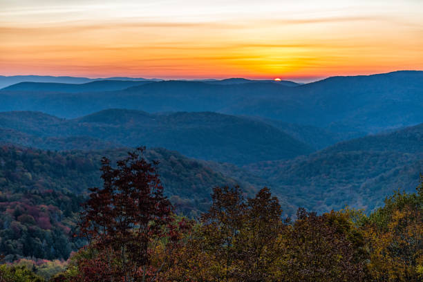 istock West Virginia Monongahela national forest with sun in Highland Scenic Highway mountains horizon overlook in autumn with colorful tree foliage at morning sunrise 1319990077