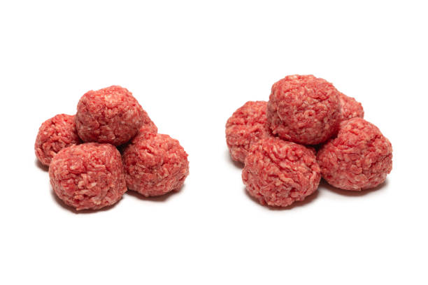 istock Raw meat balls isolated on white background. 1319993829