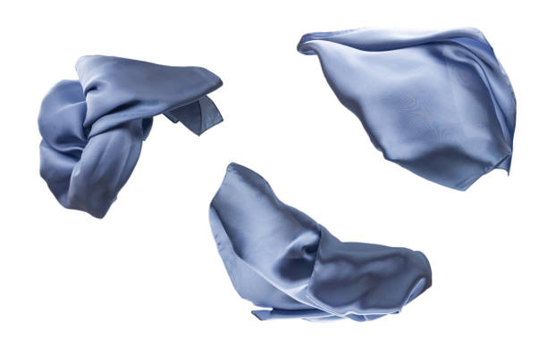 istock Flowing blue silk scarf isolated on white background. 1319993863