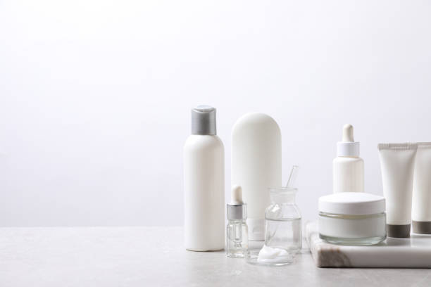 istock Organic cosmetic products and laboratory glassware on white table, space for text 1319994844
