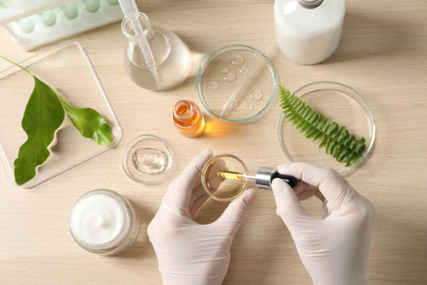 istock Scientist making cosmetic product at table, top view 1319995005