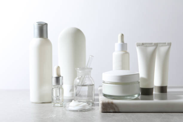 istock Organic cosmetic products and laboratory glassware on white table 1319995014