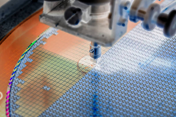 istock Pick up silicon die in silicon wafer in die attach machine in semiconductor manufacturing 1319996152