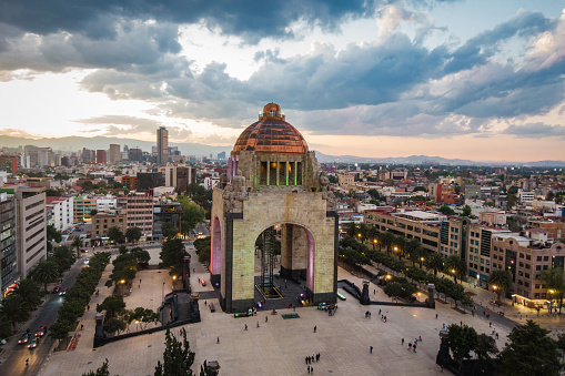 Aerial view of city centre including historical landmark Monument to the Revolution (Spanish: Monumento a la Revolucion) located at Republic Square in Mexico City, Mexico.
