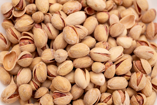 Pistachios background and nuts texture.