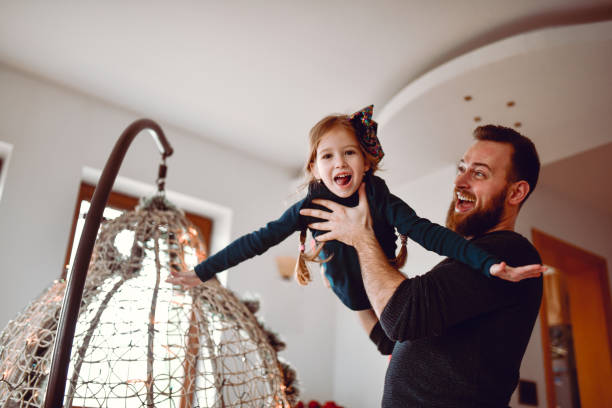 istock Bearded Father Playing With Child Daughter At Home 1320004847