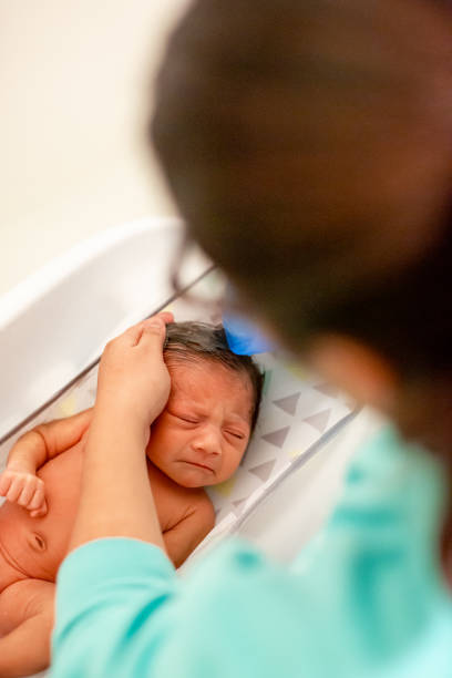 istock Newborn Baby Getting A Bath at Home 1320004887