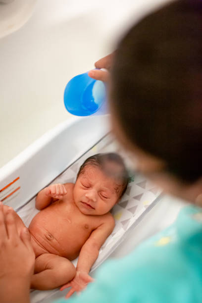 istock Newborn Baby Getting A Bath at Home 1320004919