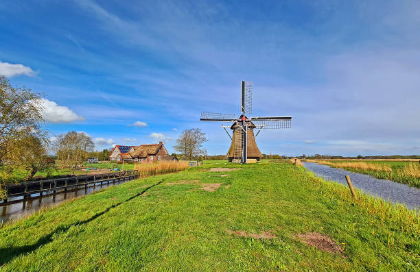 istock Oudkerker windmill in the countryside from the Netherlands 1320004958