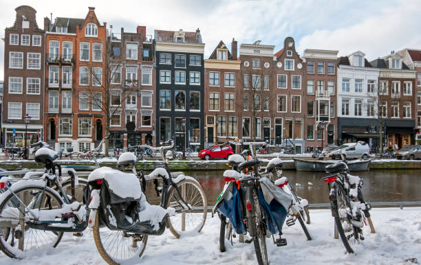istock Snowy bikes in Amsterdam in winter in the Netherlands 1320005241