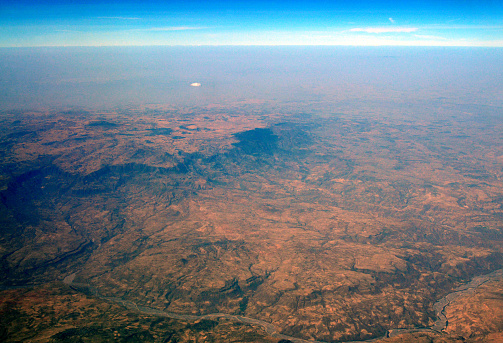 Ethiopia: aerial view of Africa's Great Rift Valley - This tectonic fault stretches in Africa for about 3,000 kilometers in length from North to South, from Eritrea to Mozambique, passing through the great African lakes. It cuts the Horn of Africa in two: the Somali plate to the east moves away from the African plate to the west. The Great Rift Valley experiences intense volcanic activity, of great complexity that cannot be seen anywhere else.