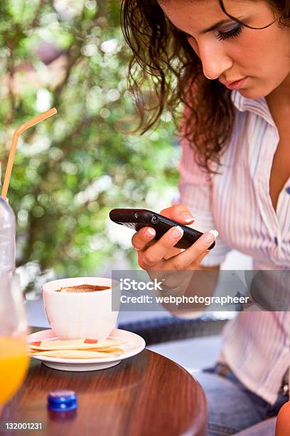 Reading Cell Phone Message Stock Photo - Download Image Now - 20-29 Years, 30-39 Years, Adult