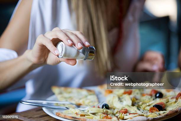 Salting Pizza Stock Photo - Download Image Now - Salt - Seasoning, Salt Shaker, Food