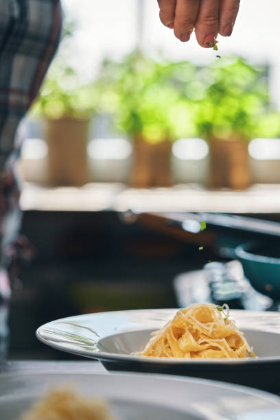 istock Preparing Fettuccine Pasta Alfredo 1320014550