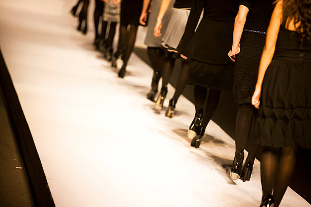 Catwalk Female models walking on catwalk,space for copy, canon 1Ds mark III fashion show stock pictures, royalty-free photos & images