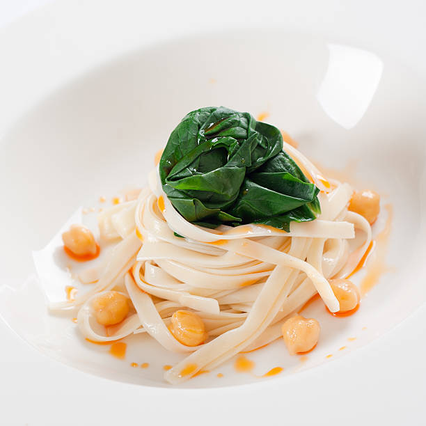 Tagliatelle with spinach stock photo