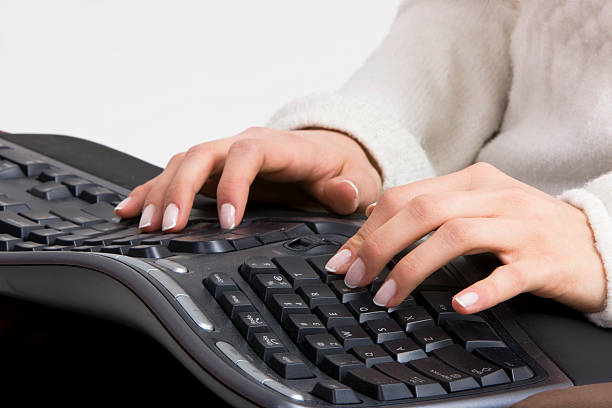 Typing Woman typing on computer keyboard,  canon 1Ds  mark III ergonomic keyboard photos stock pictures, royalty-free photos & images